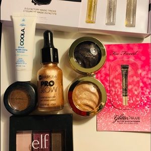 Lot of make up. Eye shadow, Mac, believe